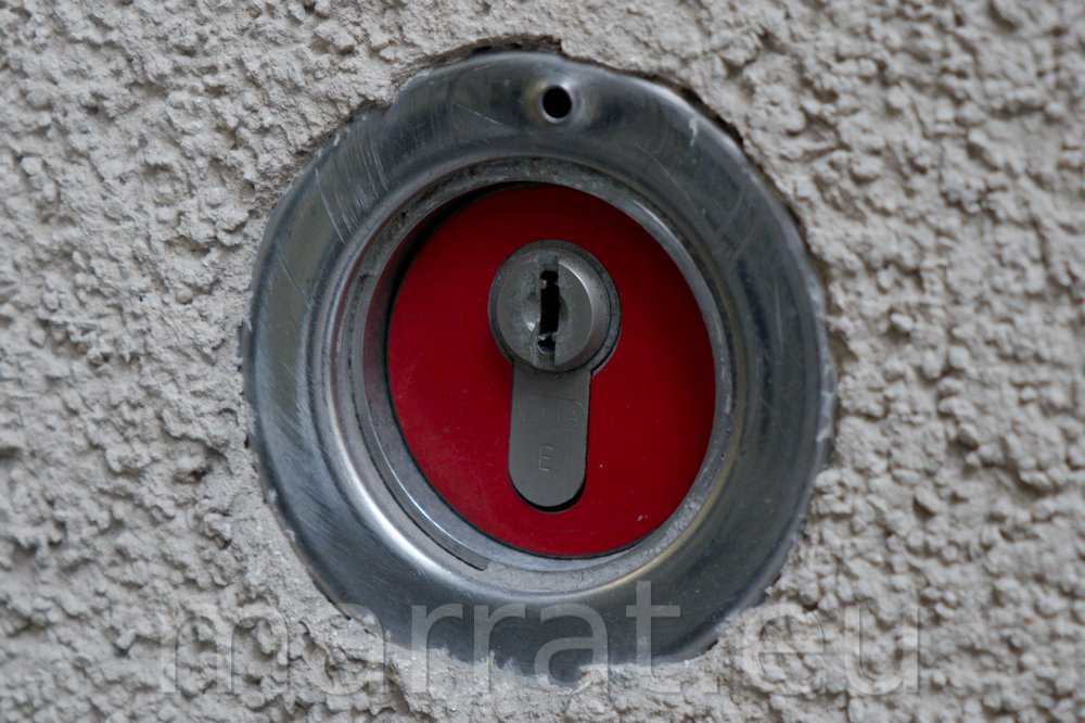 Red lock on a wall